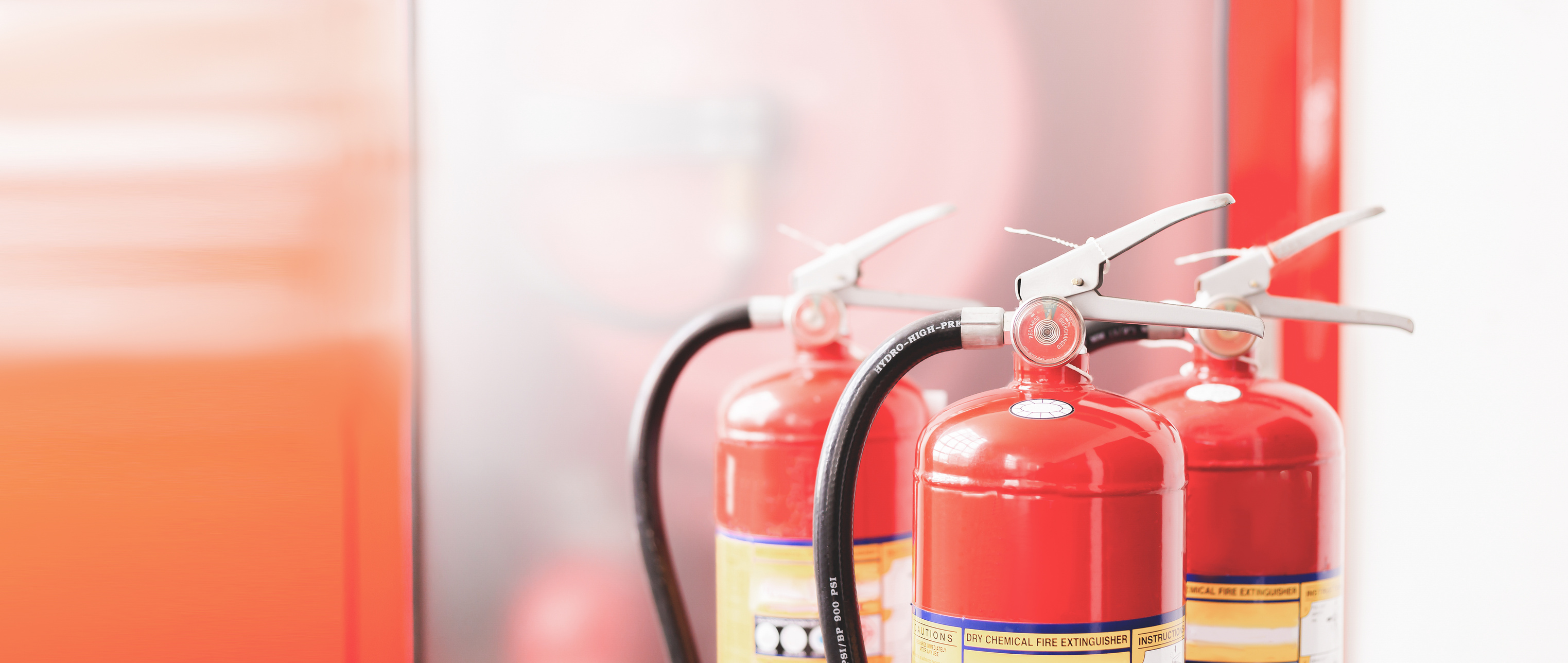 The red fire extinguisher is ready for use in case of an indoor fire emergency.